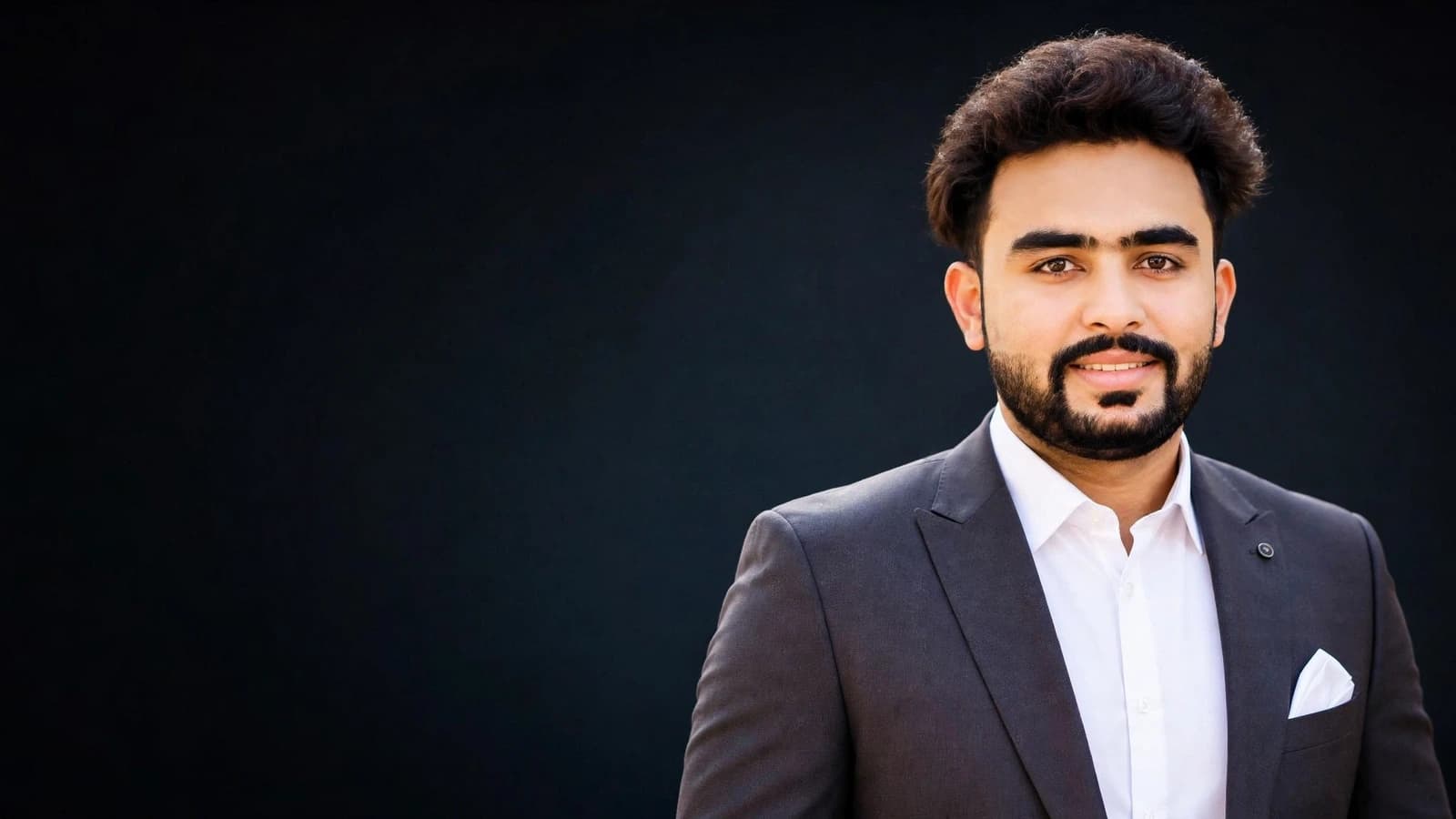 Adnan Ashraf, professional portrait in a dark studio setting